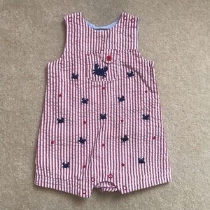 Red and white striped crab print overall.